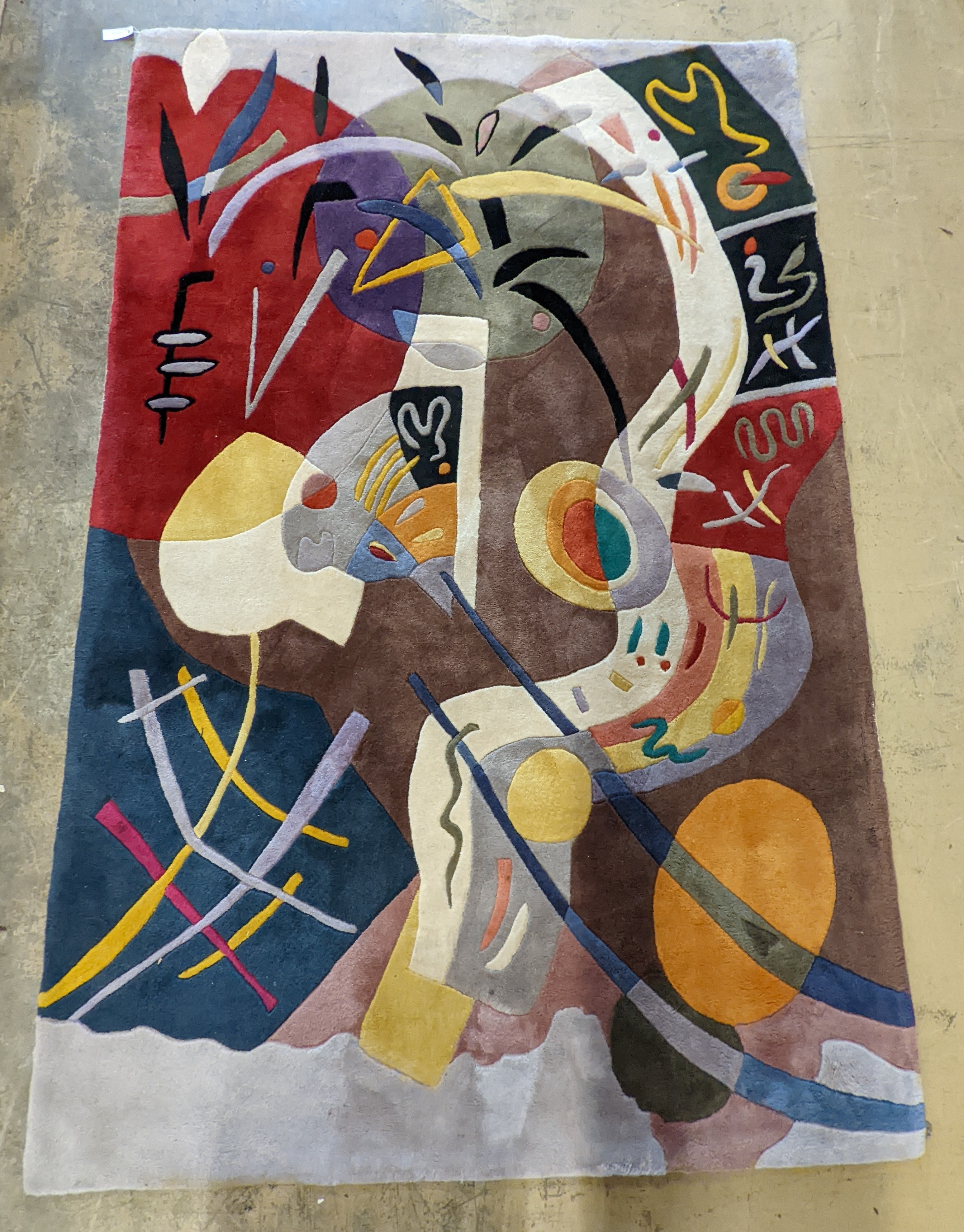 A contemporary Picasso inspired polychrome abstract pattern rug, 246 x 160cm